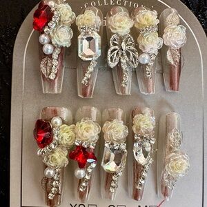 Elegant Floral Nail Art Set with Red and Cream Accents